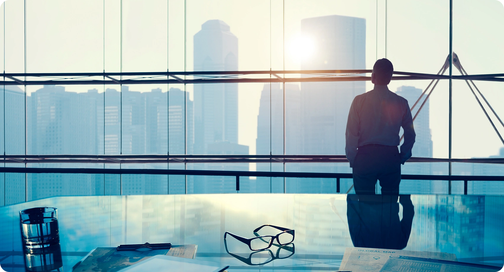 Business professional analyzing data on multiple screens